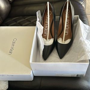 Black Calvin Klein Gayle pumps. 3.27" stiletto heel size 7 1/2M